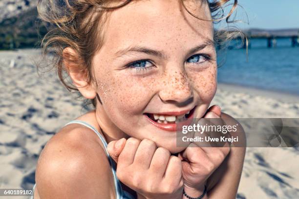 portrait of girl on beach, close up - freckle stock pictures, royalty-free photos & images