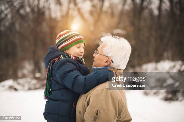 i love you grandpa - grandfather child snow winter stock pictures, royalty-free photos & images