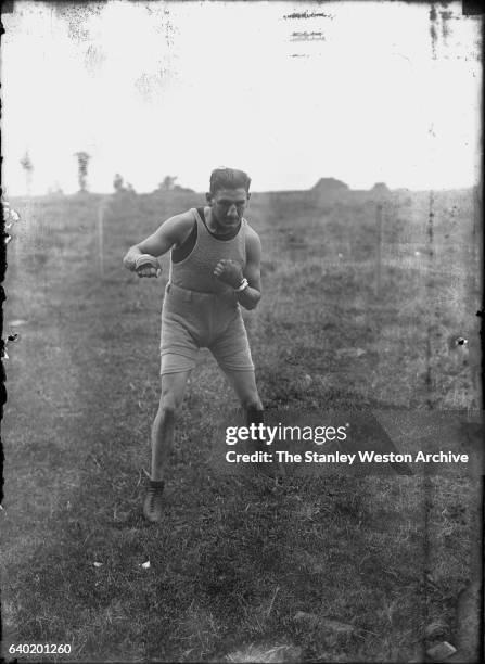 Middleweight champion Johnny Wilson training outdoors at Manhasset, L.I., New York, August 31, 1921.