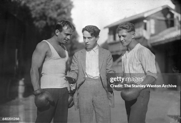 Left to Right: Joe Benjamin the contender for Benny Leonard's Lightweight Title, Charlie Chaplin, and Douglas Fairbanks Sr., in Hollywood,...