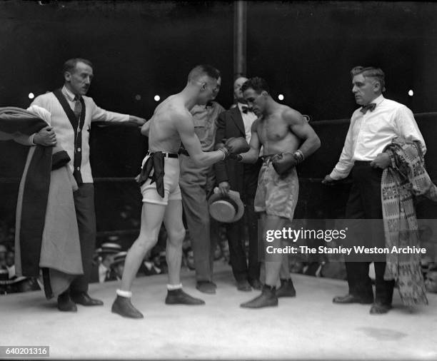 Johnny Dundee and Featherweight Champion Eugene Criqui square-off just before the bell started their title fight at the Polo Grounds, New York, New...