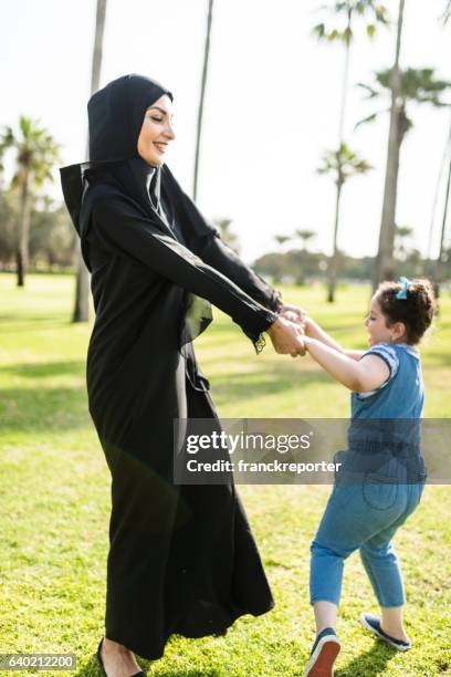 mother and daughter having fun in the park