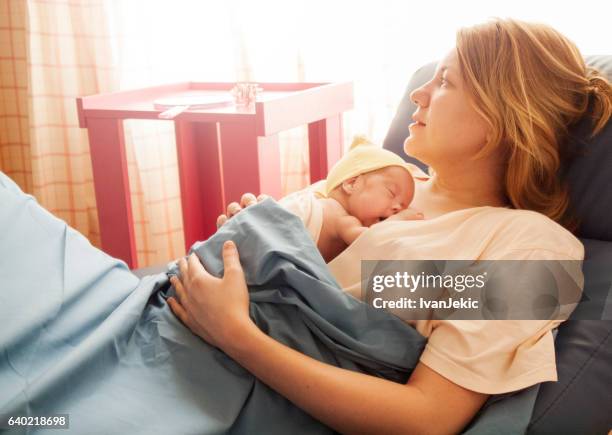 premature baby girl resting on mother's breasts - premature baby stock pictures, royalty-free photos & images