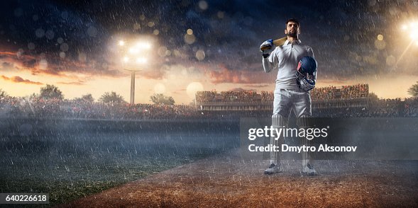 Cricket player batsman on the stadium Cricket player batsman on the stadium