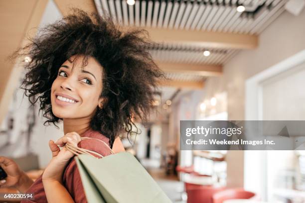 women with shopping bags - latin american and hispanic shopping bags stock pictures, royalty-free photos & images