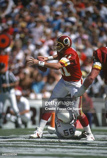 Mark Rypien of the Washington Redskins in action against the Phoenix Cardinals during an NFL football game September 30, 1990 at Sun Devil Stadium in...