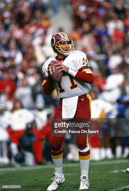 Washington, D.C. Mark Rypien of the Washington Redskins drops back to pass during an NFL football game circa 1992 at RFK Stadium in Washington, D.C.....