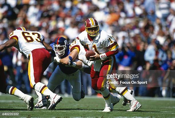 Washington, D.C. Mark Rypien of the Washington Redskins in action against the New York Giants during an NFL football game October 10, 1993 at RFK...