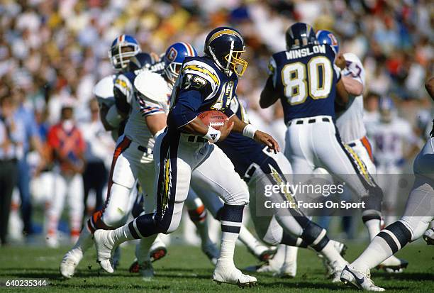 Tim Spencer of the San Diego Chargers carries the ball against the Denver Broncos during an NFL football game December 24, 1989 at Jack Murphy...