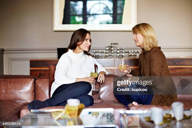 enjoying a chat with mom - drinking alcohol at home stock pictures, royalty-free photos & images