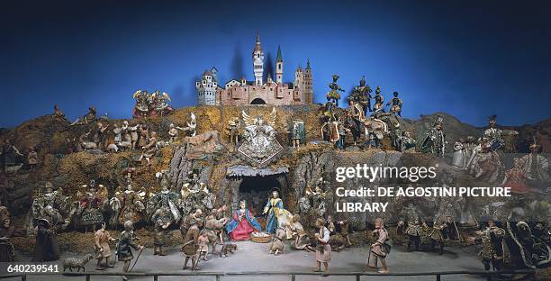 Nativity scene with carved and painted wooden figurines dressed in fabric clothing, Monaco. Germany, 19th century. Monaco, Bayerisches Nationalmuseum