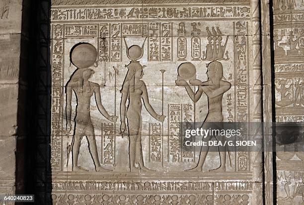The Roman Emperor Trajan depicted as a pharaoh offerings bearer to the Goddess Hator and Horus, relief from the Roman Mammisi, Temple of Hathor,...