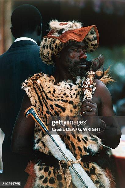 Man dressed in leopard skin during the coronation feast for the Kabaka , Kampala, Uganda.