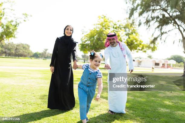 happiness family walking in the park in saudi arabia - arab family outdoor bildbanksfoton och bilder