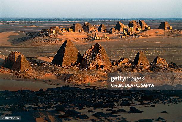 Funeral pyramids and temples from the Kingdom of Kush , necropolis on the Island of Meroe , Sudan. Meroitic civilisation.