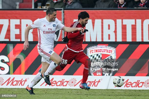 Kyriakos Papadopoulos of Hamburger and Almog Cohen of Ingolstadt battle for the ball during the Bundesliga match between FC Ingolstadt 04 and...