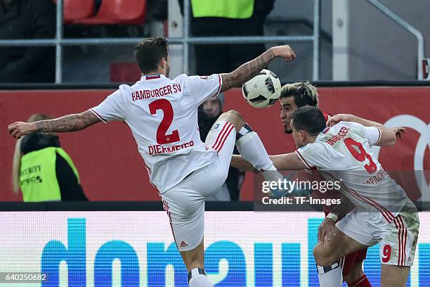 Dennis Diekmeier of Hamburger and Kyriakos Papadopoulos of Hamburger, Dario Lezcano of Ingolstadt battle for the ball during the Bundesliga match...