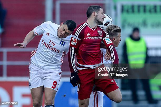 Kyriakos Papadopoulos of Hamburger, Matthias Ostrzolek of Hamburger and Mathew Leckte of Ingolstadt battle for the ball during the Bundesliga match...