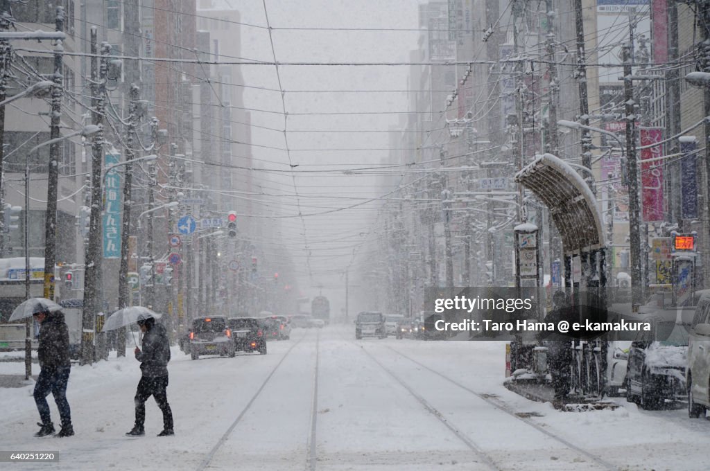 Local train and people in the snow city, Sapporo