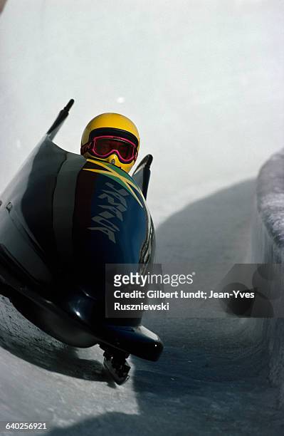 Jamaican bobsledding team on a curve during the 1988 Winter Olympics.