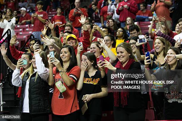 University of Maryland students react as First Lady Michelle Obama acknowledges them during men's NCCA basketball between University of Maryland and...
