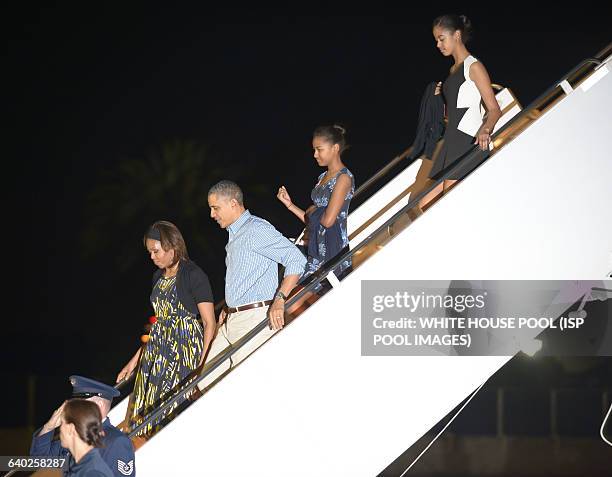 The First Family, President Barack Obama, Michelle Obama, Sasha Obama and Malia Obama arrive at Joint Base Pearl Harbor-Hickam for there winter...