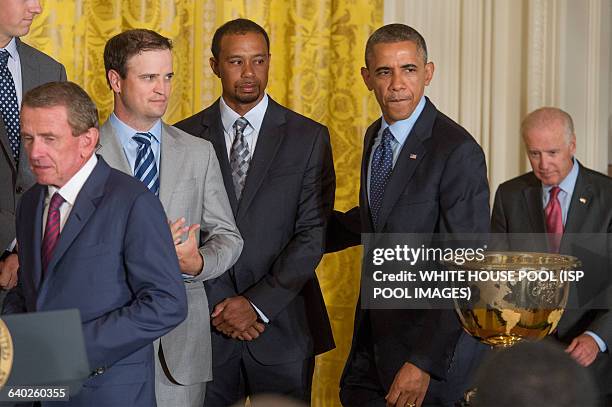 President Barack Obama , enters beside US golfer Tiger Woods , US golfer Zack Johnson , PGA Tour Commissioner Tim Finchem and US Vice President Joe...