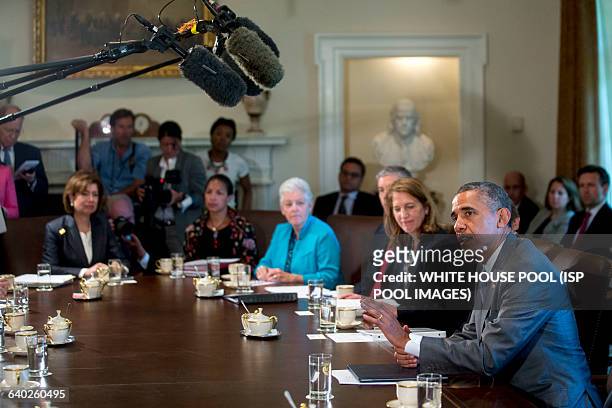 President Barack Obama, right, speaks during a cabinet meeting at the White House with Sylvia Mathews Burwell, secretary of the U.S. Department of...