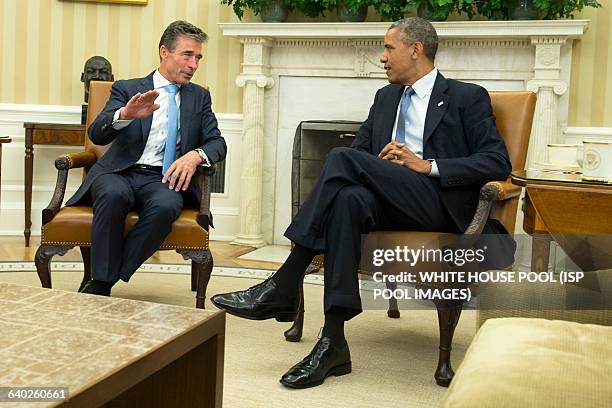 President Barack Obama meets with NATO Secretary General Anders Fogh in the Oval Office at the White House in Washington, D.C. On July 8, 2014.