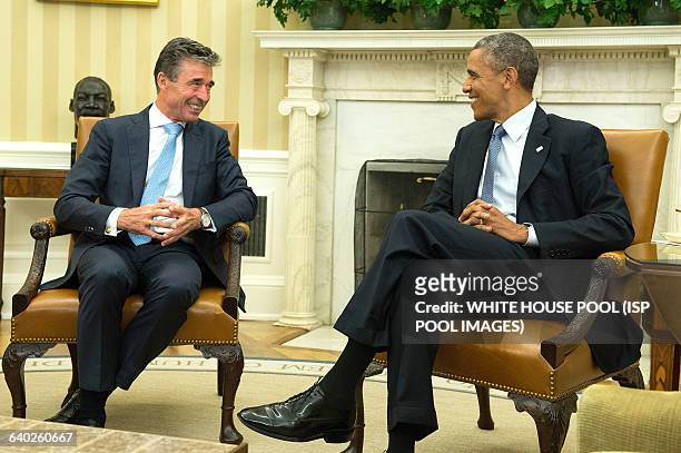 President Barack Obama meets with NATO Secretary General Anders Fogh in the Oval Office at the White House in Washington, D.C. On July 8, 2014.