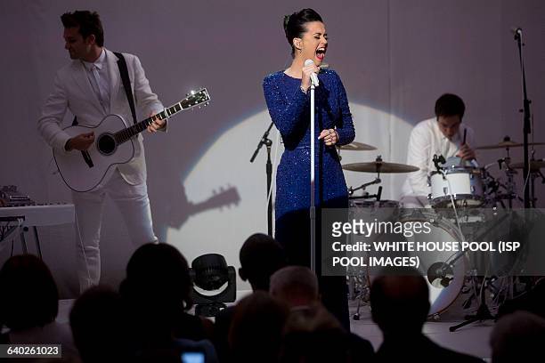 Singer Katy Perry performs during a a concert commemorating the Special Olympics with U.S. President Barack Obama, not pictured, in the State Dining...
