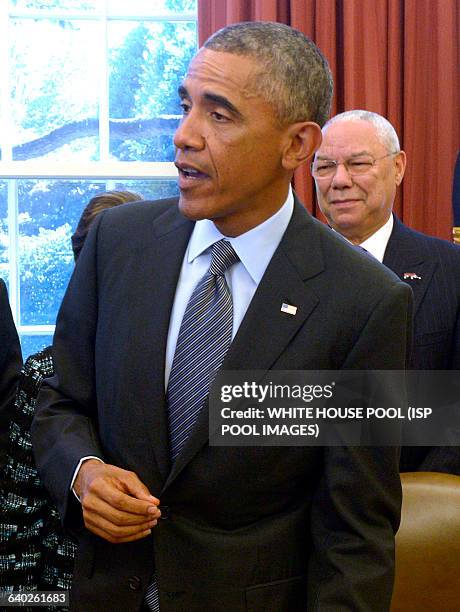 President Barack Obama, with America's Promise Alliance Founding Chairman and former US Secretary of State General Colin Powell , responds to a...