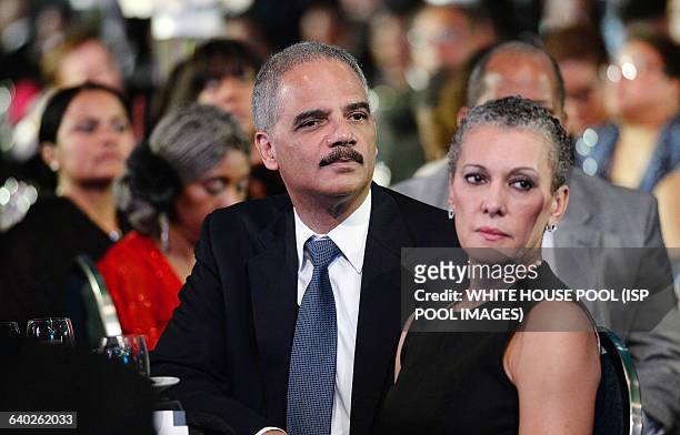 Attorney General Eric Holder and his wife, Sharon Malone attend the Congressional Black Caucus Foundation Annual Phoenix Awards dinner, September 27,...