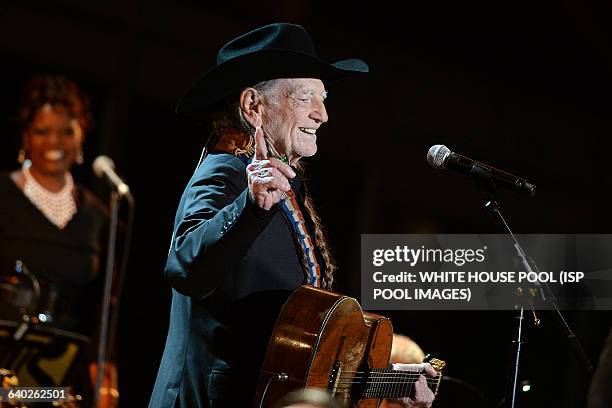 Singer Willie Nelson performs at "A Salute to the Troops: In Performance at the White House" concert on the South Lawn November 6, 2014 in...