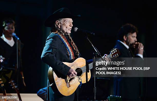 Singer Willie Nelson performs at "A Salute to the Troops: In Performance at the White House" concert on the South Lawn November 6, 2014 in...