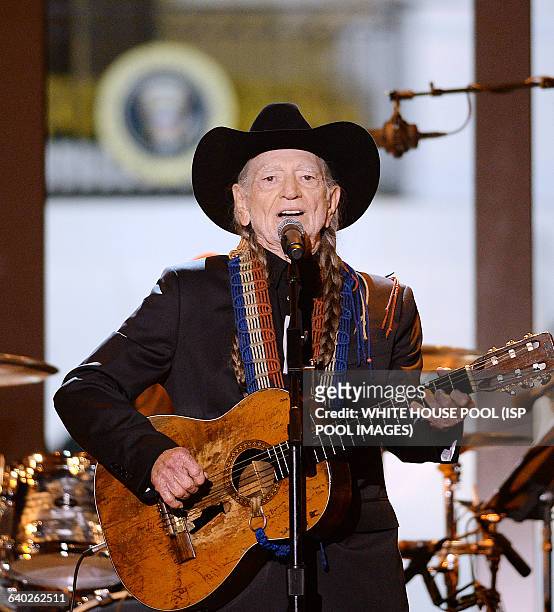 Singer Willie Nelson performs at "A Salute to the Troops: In Performance at the White House" concert on the South Lawn November 6, 2014 in...