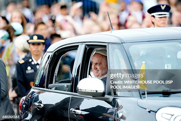 His Holiness Pope Francis is being transported to Washington D.C in a Fiat 500 at Joint Base Andrews in Maryland on September 22, 2015. The Pope is...