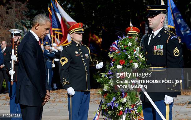 President Barack Obama lays a wreath at the Tomb of the Unknown Soldier at Arlington National Cemetery, November 11 , 2015 in Arlington, Virginia....