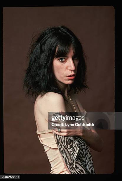 Punk rock singer and poet Patti Smith poses for a studio portrait.