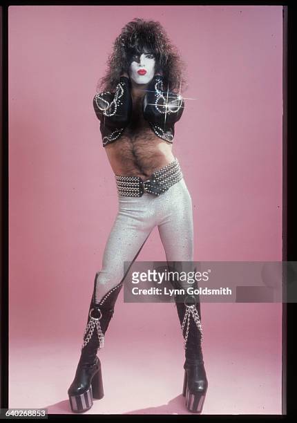 Full-length studio portrait of Paul Stanley, guitarist and vocalist, of the rock & roll band Kiss. He is shown in full Kiss regalia, white and black...