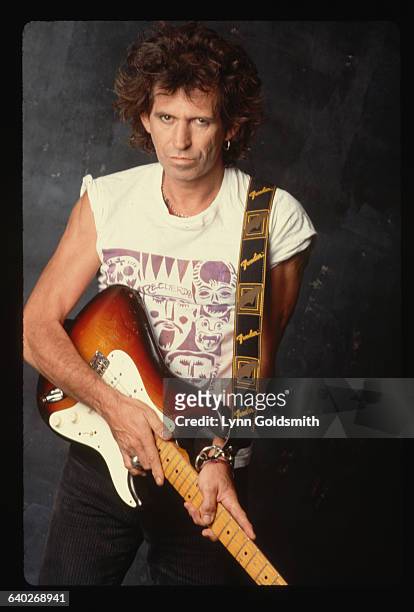 Keith Richards, guitarist for the Rolling Stones, poses with his Fender Stratocaster.