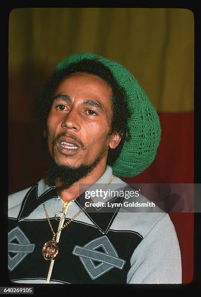 Bob Marley wears a green knit hat.