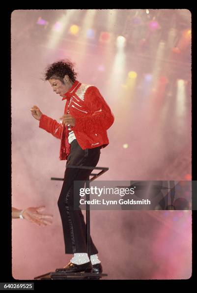 Mj Singer Michael Jackson on stage performing. He is shown full-length, on a ...