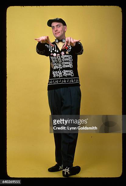 Rick Nielsen, guitarist for the rock group Cheap Trick, poses in one of his characteristic sweaters.