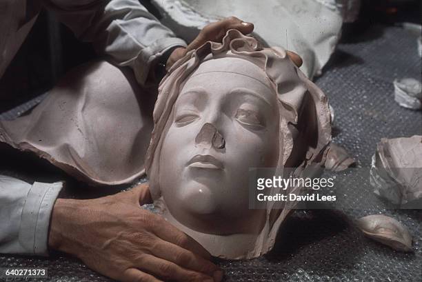 The damaged face of the Virgin Mary from Michelangelo's Pieta at St. Peter's, Rome, prior to restoration.