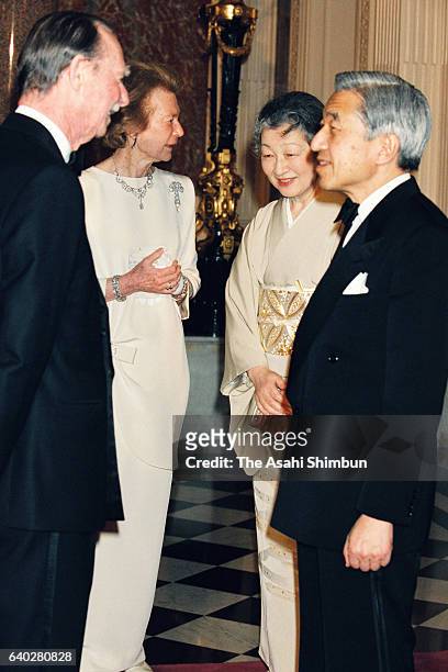 Grand Duke Jean and Grand Duchess Josephine Charlotte of Luxembourg welcome Emperor Akihito and Empress Michiko prior to a return reception at the...