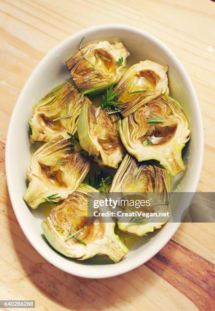 artichokes with rosemary, halved - alcachofra imagens e fotografias de stock