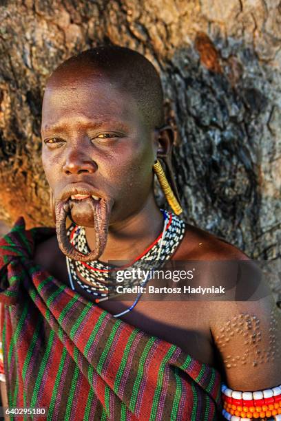 portrait of woman from mursi tribe, ethiopia, africa - mursi tribe stock pictures, royalty-free photos & images