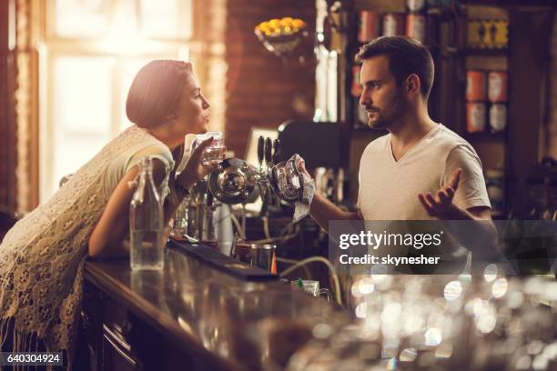 one more drink, please? i think you had enough! - weigeren stockfoto's en -beelden