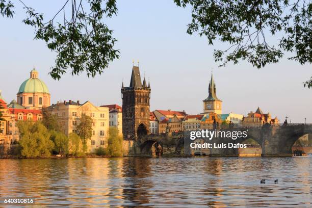 charles bridge, stare mesto and vltava river. prague - karlsbrücke stock-fotos und bilder